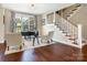 Elegant home office featuring hardwood floors, natural light, and staircase at 1011 Duntov Dr, Monroe, NC 28110