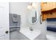 Bathroom with a sink, mirror, wooden cabinet, and gray towels at 1140 Mckinnon Dr, Rock Hill, SC 29732