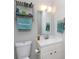 A well-lit bathroom featuring a sink, mirror, and towel rack for convenience at 1140 Mckinnon Dr, Rock Hill, SC 29732