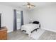 This cozy bedroom features a ceiling fan, large window, and neutral walls at 1140 Mckinnon Dr, Rock Hill, SC 29732