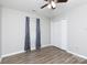 A bedroom with a ceiling fan, a window with gray curtains, and a closet at 1140 Mckinnon Dr, Rock Hill, SC 29732