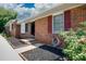 Charming brick home featuring a well-maintained front yard with red shutters and tidy landscaping at 1140 Mckinnon Dr, Rock Hill, SC 29732
