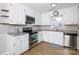 Bright kitchen features white cabinets, stainless steel appliances, and a modern countertop at 1140 Mckinnon Dr, Rock Hill, SC 29732