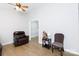 Cozy living room with modern flooring, ceiling fan, and comfortable seating arrangement at 1140 Mckinnon Dr, Rock Hill, SC 29732