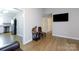Spacious living room with open doorway, neutral wall color, and contemporary flooring at 1140 Mckinnon Dr, Rock Hill, SC 29732