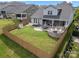 Expansive fenced backyard with a patio, fire pit, grilling area, and lush lawn, great for entertaining at 12415 Es Draper Dr, Huntersville, NC 28078