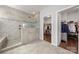 This bathroom is equipped with a stunning walk-in shower and features access to a walk-in closet at 12415 Es Draper Dr, Huntersville, NC 28078