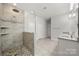 This stylish bathroom features a glass-enclosed shower and double vanity at 12415 Es Draper Dr, Huntersville, NC 28078
