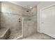 Beautiful bathroom featuring a frameless glass shower, tiled walls, and modern fixtures at 12415 Es Draper Dr, Huntersville, NC 28078
