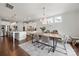 Bright open floorplan features a dining space attached to a modern kitchen at 12415 Es Draper Dr, Huntersville, NC 28078