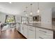 Open-concept kitchen showcases a large island with pendant lighting and stainless steel appliances at 12415 Es Draper Dr, Huntersville, NC 28078
