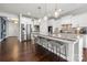 Open-concept kitchen with a large island, stainless steel appliances, and seating at 12415 Es Draper Dr, Huntersville, NC 28078