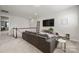 Inviting loft space with a comfortable sofa, TV, and stylish decor for relaxation and entertainment at 12415 Es Draper Dr, Huntersville, NC 28078