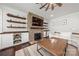 This spacious living room features a stone fireplace, built-in shelving, and recessed lighting at 12415 Es Draper Dr, Huntersville, NC 28078