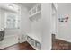 Convenient mudroom entry with built-in storage and bench seating for organization at 12415 Es Draper Dr, Huntersville, NC 28078