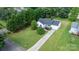 An aerial view of a home surrounded by green trees in a well-maintained landscape at 1265 39Th Street Cir, Hickory, NC 28602