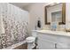 Cozy bathroom featuring a shower with a decorative shower curtain and wood-look floors at 1265 39Th Street Cir, Hickory, NC 28602