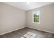 Bright bedroom with hardwood floors and window views at 1265 39Th Street Cir, Hickory, NC 28602