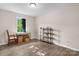 Bedroom with a window, wood-look flooring, and shelves at 1265 39Th Street Cir, Hickory, NC 28602