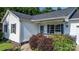 Home's inviting entry with dark shutters and a small porch at 1265 39Th Street Cir, Hickory, NC 28602