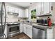 This kitchen features modern appliances, white cabinets, and hardwood flooring at 1265 39Th Street Cir, Hickory, NC 28602