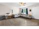 Bright living room with a large sectional sofa and hardwood flooring at 1265 39Th Street Cir, Hickory, NC 28602
