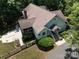 Aerial view of a home with a screened-in porch, fenced yard, and walkway at 14019 Fountain Ln, Charlotte, NC 28278