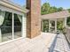 Exterior shot of back deck featuring painted wood, brick chimney, and access to screened porch at 14019 Fountain Ln, Charlotte, NC 28278