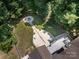 Aerial view of backyard featuring a stone firepit area and a spacious wooden deck at 14019 Fountain Ln, Charlotte, NC 28278
