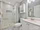 Bathroom features a large glass shower, white vanity, and bright lighting at 14019 Fountain Ln, Charlotte, NC 28278