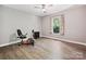 Bright bedroom with a ceiling fan, hardwood floors, and a window offering ample natural light at 14019 Fountain Ln, Charlotte, NC 28278