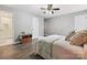Bright bedroom with wood-look floors, neutral walls, and easy access to bathroom at 14019 Fountain Ln, Charlotte, NC 28278