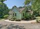Charming home with a well-manicured lawn, attractive landscaping, and a welcoming front entrance at 14019 Fountain Ln, Charlotte, NC 28278