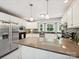 Bright kitchen featuring white cabinets, stainless steel appliances, and granite countertops at 14019 Fountain Ln, Charlotte, NC 28278