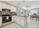 Modern kitchen with white cabinets, stainless steel appliances, and an open layout at 14019 Fountain Ln, Charlotte, NC 28278
