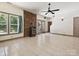 Open living room with tile floors, a fireplace, and a window view at 14019 Fountain Ln, Charlotte, NC 28278