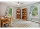 Spacious office with two windows, a desk, and two bookshelves at 14019 Fountain Ln, Charlotte, NC 28278