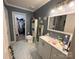 Well-maintained bathroom with single vanity, and a walk-in closet at 1412 Cold Creek Pl, Huntersville, NC 28078