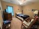 Cozy bedroom featuring a comfortable bed, ceiling fan, and Carolina Panthers accents at 1412 Cold Creek Pl, Huntersville, NC 28078