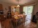 Cozy dining area featuring hardwood floors and sliding glass doors to the patio at 1412 Cold Creek Pl, Huntersville, NC 28078