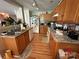 Functional kitchen with oak cabinets, laminate countertops, and white appliances at 1412 Cold Creek Pl, Huntersville, NC 28078