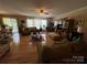 Bright living room with hardwood floors, ceiling fan, and lots of natural light at 1412 Cold Creek Pl, Huntersville, NC 28078
