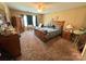 Spacious main bedroom with carpet flooring, ceiling fan, and generous closet space at 1412 Cold Creek Pl, Huntersville, NC 28078
