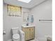 Bathroom with tile floors, single sink vanity and mirror at 143 Bostian Lake Rd, Statesville, NC 28677