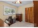 Cozy bedroom with a window view and hardwood floors at 143 Bostian Lake Rd, Statesville, NC 28677