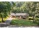 Exterior elevation featuring a ranch style home with a well manicured front lawn at 143 Bostian Lake Rd, Statesville, NC 28677