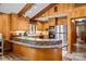 Modern kitchen with stainless steel appliances, oak cabinets, granite countertops, and breakfast bar area at 143 Bostian Lake Rd, Statesville, NC 28677