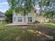 Backyard featuring a wooden deck, mature trees, and a fenced yard at 14520 Cardamon Ct, Charlotte, NC 28273