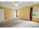 Large bedroom with carpet, ceiling fan and two windows with lots of natural light at 14520 Cardamon Ct, Charlotte, NC 28273
