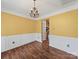 Bright dining room with wooden floors and an ornate chandelier at 14520 Cardamon Ct, Charlotte, NC 28273